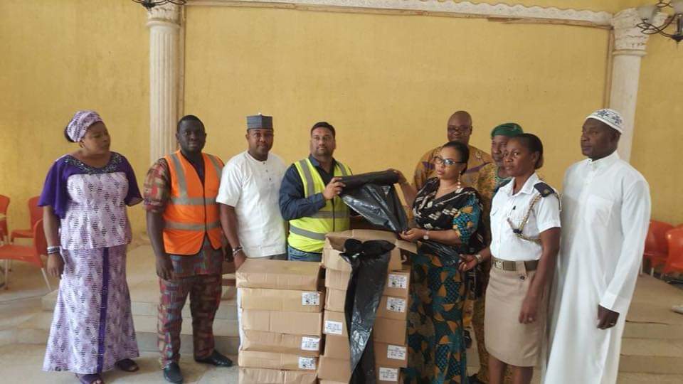 Distributing biodegradable liners to LAWMA (Lagos Waste Management Authority) team in Lagos, Nigeria